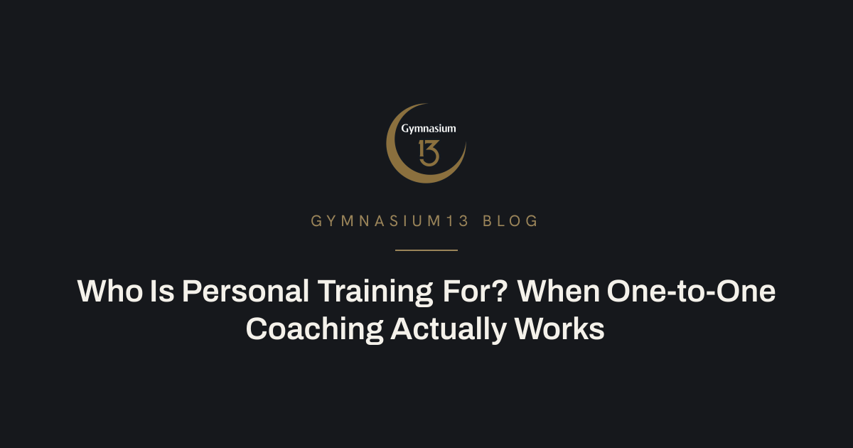 A coach guiding a client through a strength movement